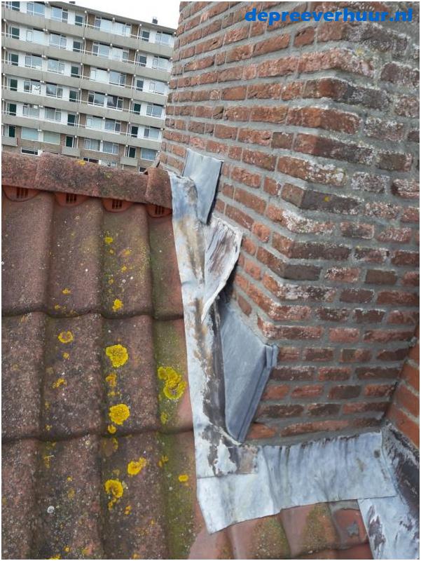Lekkage schoorsteen door openstaande loodslabben