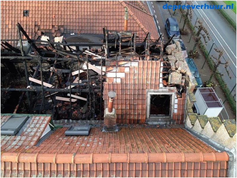 Lekkage door brand bij de buren
