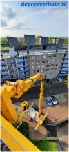 Renovatie flats Middelburg met vrachtwagenhoogwerker